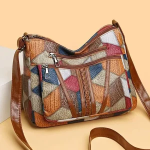 Neutral style backpack for moms with a strap design. Single shoulder bag with a patchwork pattern. Adjustable shoulder strap.